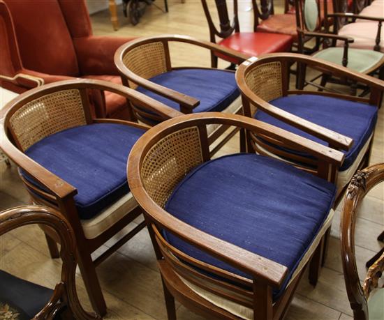 Four club chairs and two sets of silk cushions to each chair